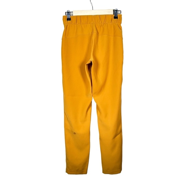 LULULEMON On the Fly 7/8 Woven Pant 27” in Fools Gold - Picture 7 of 13